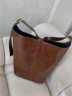Ruda išskirtinės formos natūralios odos rankinė „Orlina Sculpt Bag“